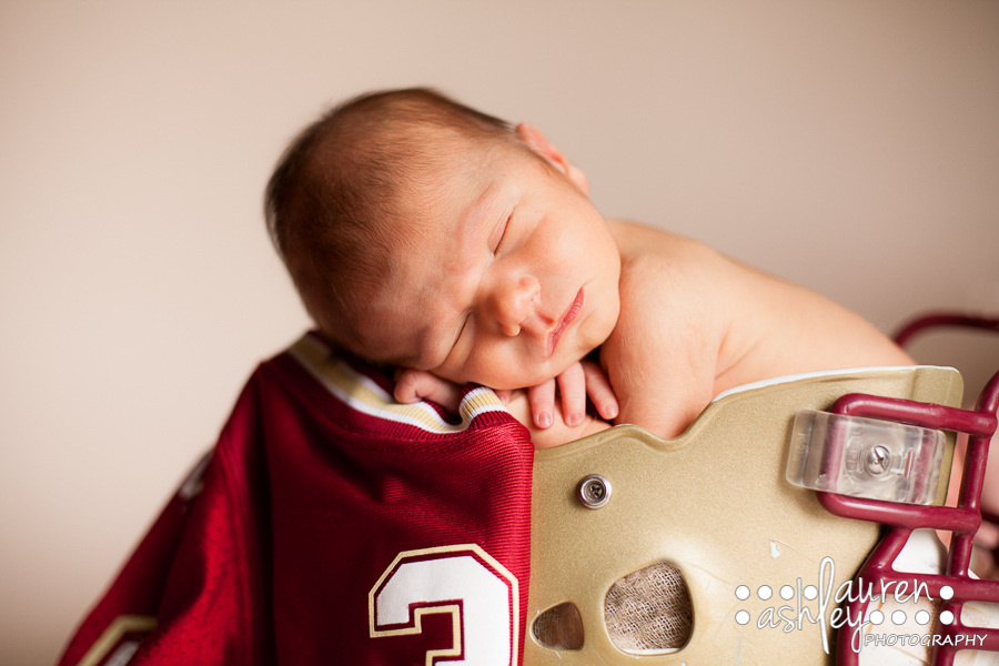 Baby Boy Photo in a football helmet in Cedar Rapids
